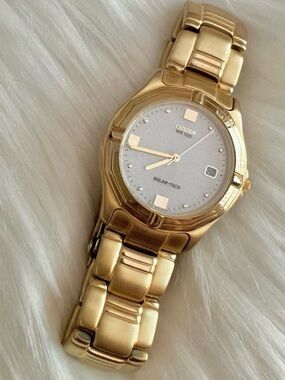 Citizen Eco-Drive technology solar-tech gold date watch men men’s brushed metal